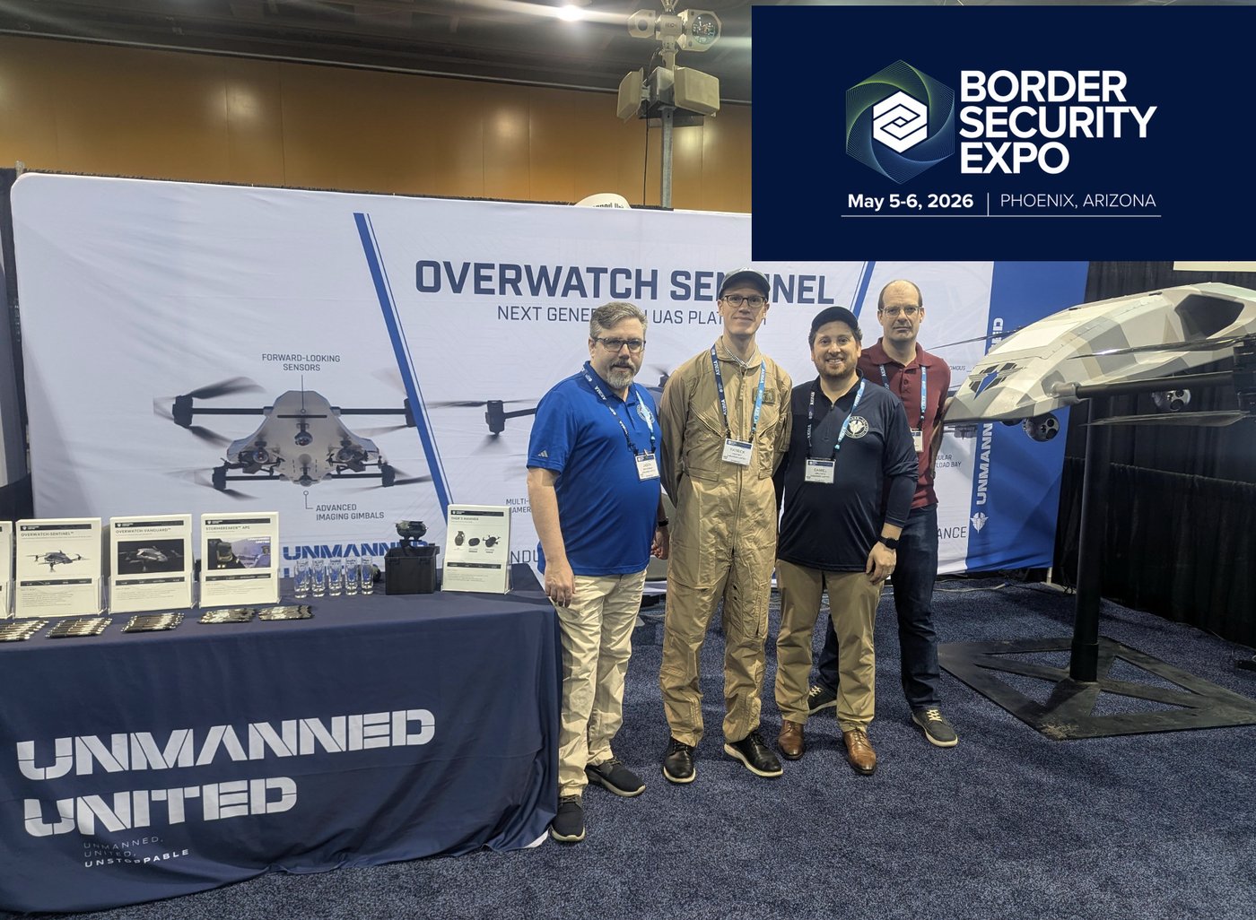 The Unmanned United team at the Border Security Expo 2026 booth in Phoenix, Arizona, beside the Overwatch Sentinel display