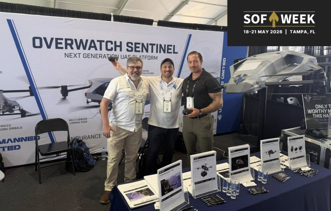 The Unmanned United team at the SOF Week 2026 booth in Tampa, Florida, beside the Overwatch Sentinel display